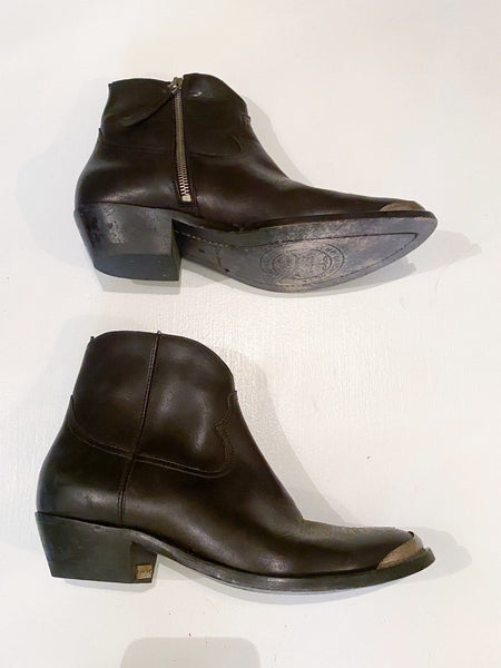 Christmas Prezzie! Like new Golden Goose ankle boots. Only worn a few times! The wear that you see on the soles is how they come when you purchase a new pair- golden goose known for distressed and making their shoes have a "worn" look. Size 38/8. True to size. Originally $850. Black leather. 