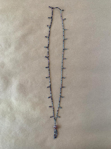 Beaded necklace with carved stone eagle.