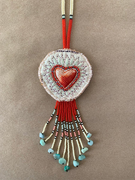 Handmade beaded and quilted necklace.