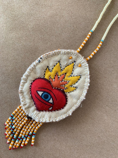Beaded and quilted handmade necklace.