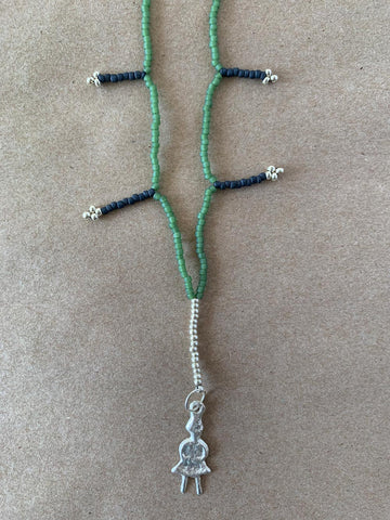 Handmade beaded charm necklace.