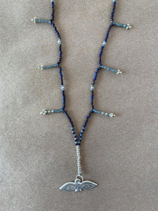Hand beaded charm necklace.