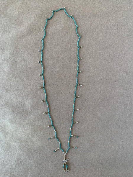 Handmade beaded charm necklace.